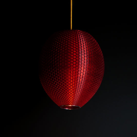 Crimson red sculptural pendant light with faceted surface design