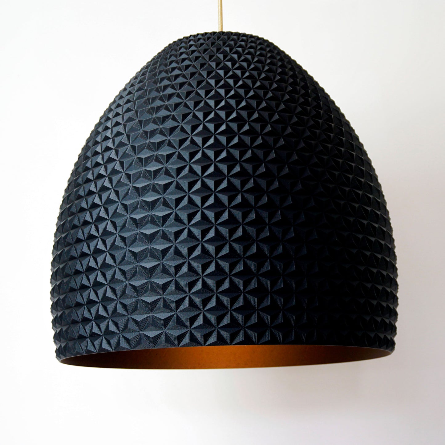 Black Dome Geometric Pendant Light shown turned on highlighting geometric facets and matte black sculptural design