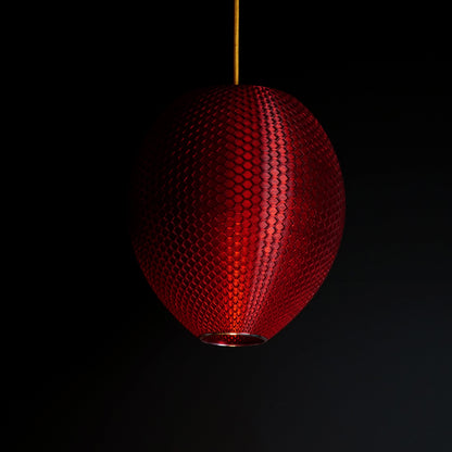 Crimson red sculptural pendant light shown turned off, highlighting design and surface detail