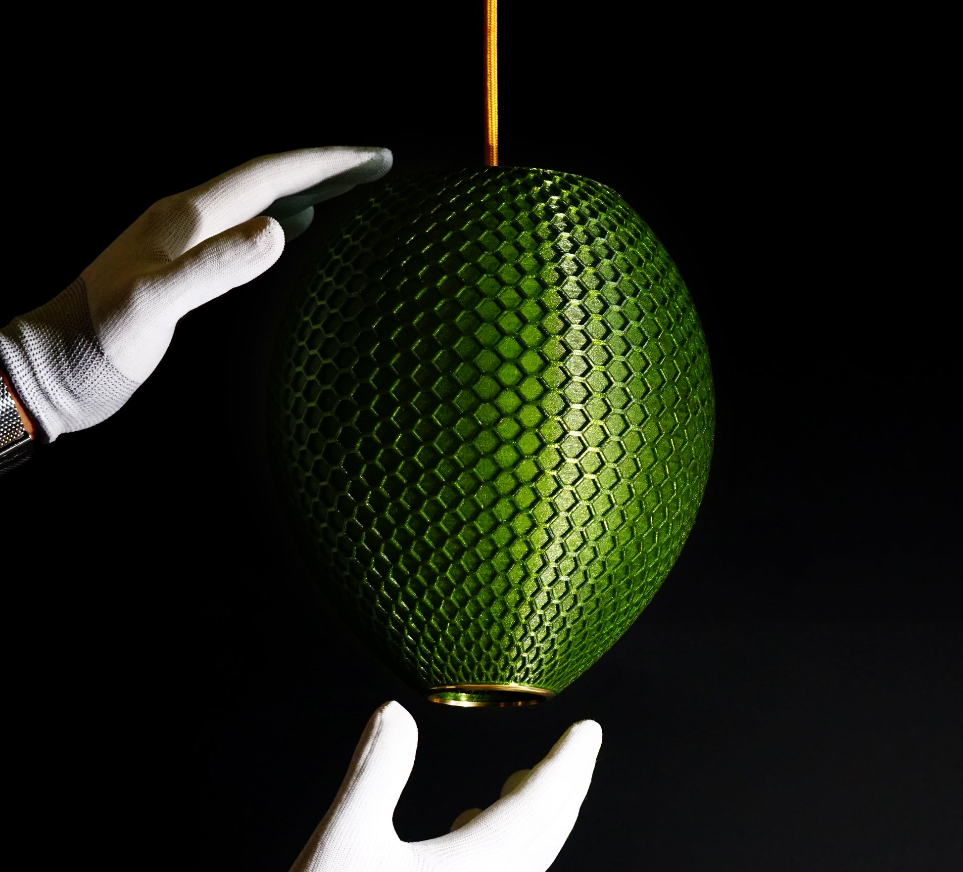 Side view of Emerald Green Hive Pendant Light showing rounded form and geometric honeycomb facets