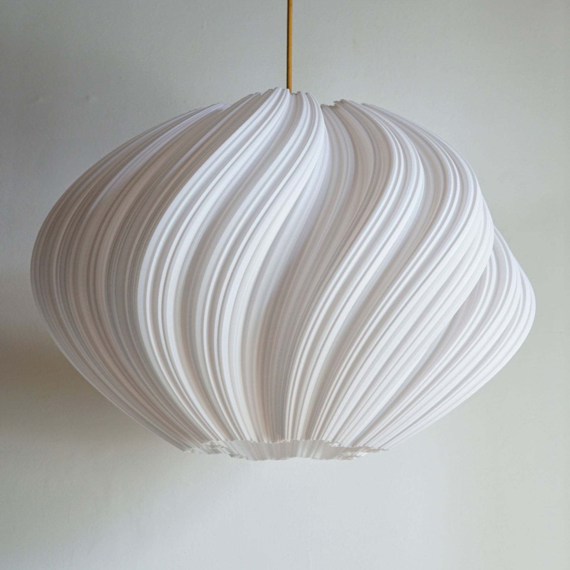 Large White Seashell Pendant Light shown turned off highlighting flowing spiral design and sculptural elegance