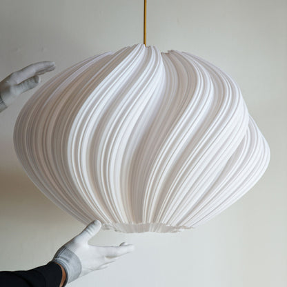 Side view of Large White Seashell Pendant Light showing flowing spiraling form and elegant curves