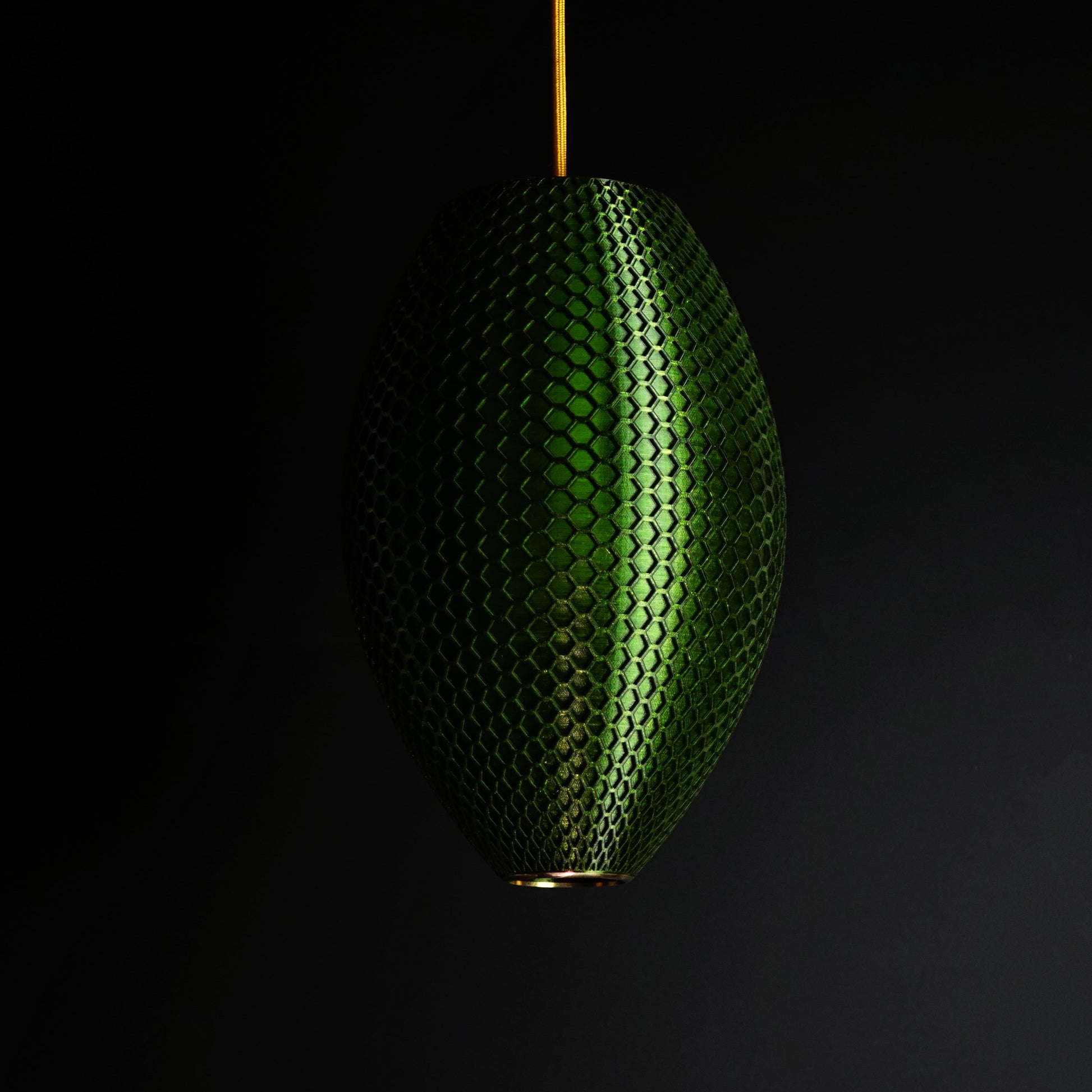 Long Emerald Green Hive Pendant Light shown turned off highlighting geometric sculptural design and hexagonal pattern