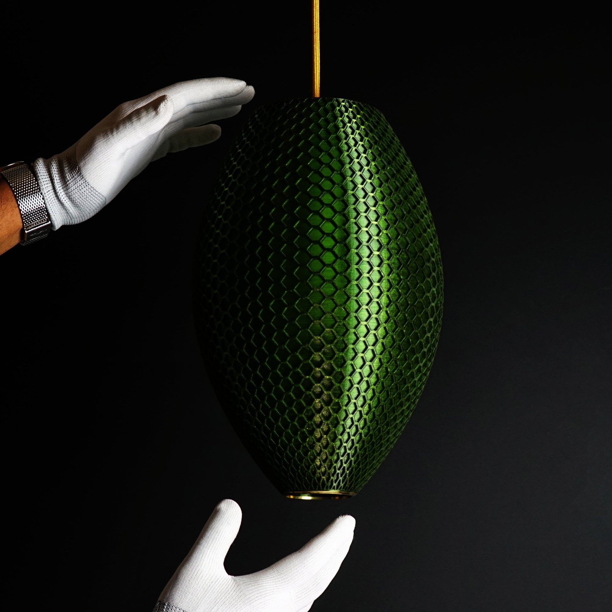 Side view of Long Emerald Green Hive Pendant Light showing elongated sculptural form