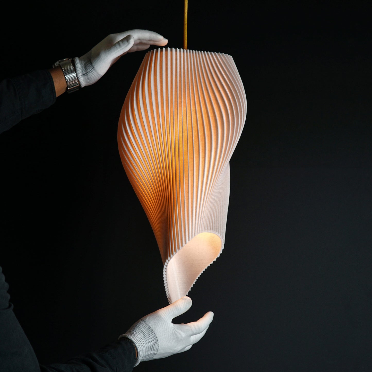Side view of Straw Long Wave Pendant Light showing elongated wave shape and textured straw finish