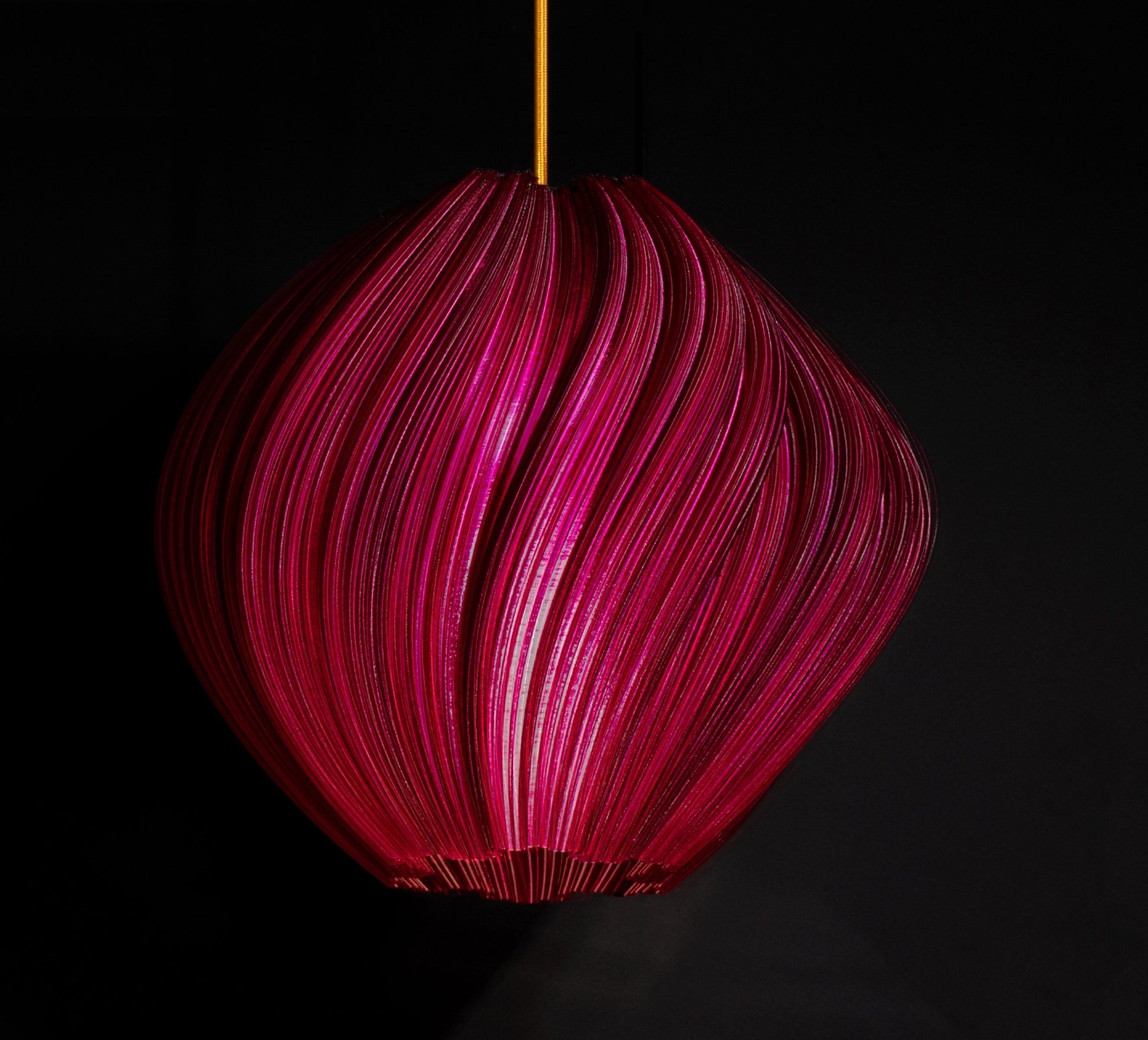 Violet Purple Seashell Pendant Light illuminated, casting ambient glow and highlighting flowing sculptural curves