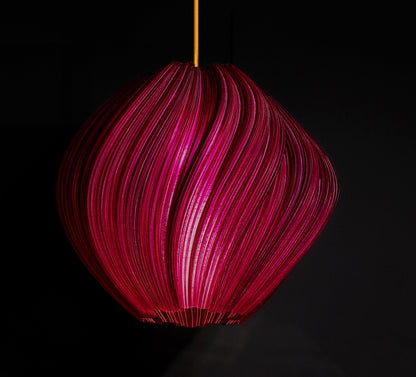 Violet Purple Seashell Pendant Light illuminated, casting ambient glow and highlighting flowing sculptural curves