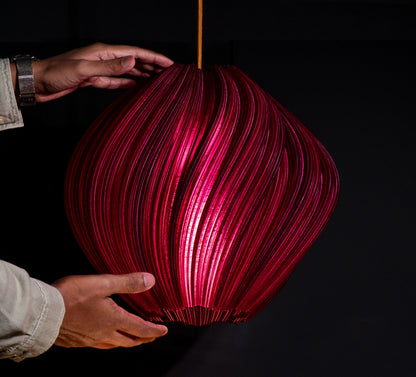 Side view of Violet Purple Seashell Pendant Light showing spiraling seashell-inspired form