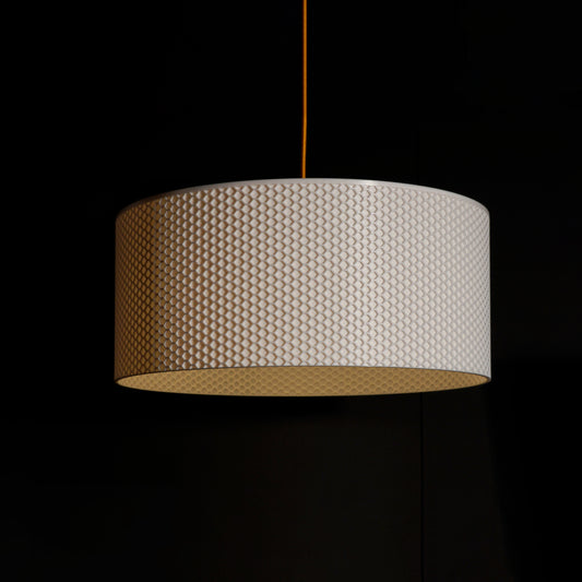 White Drum Hive Pendant Light with cylindrical drum form and sculptural hive-inspired pattern