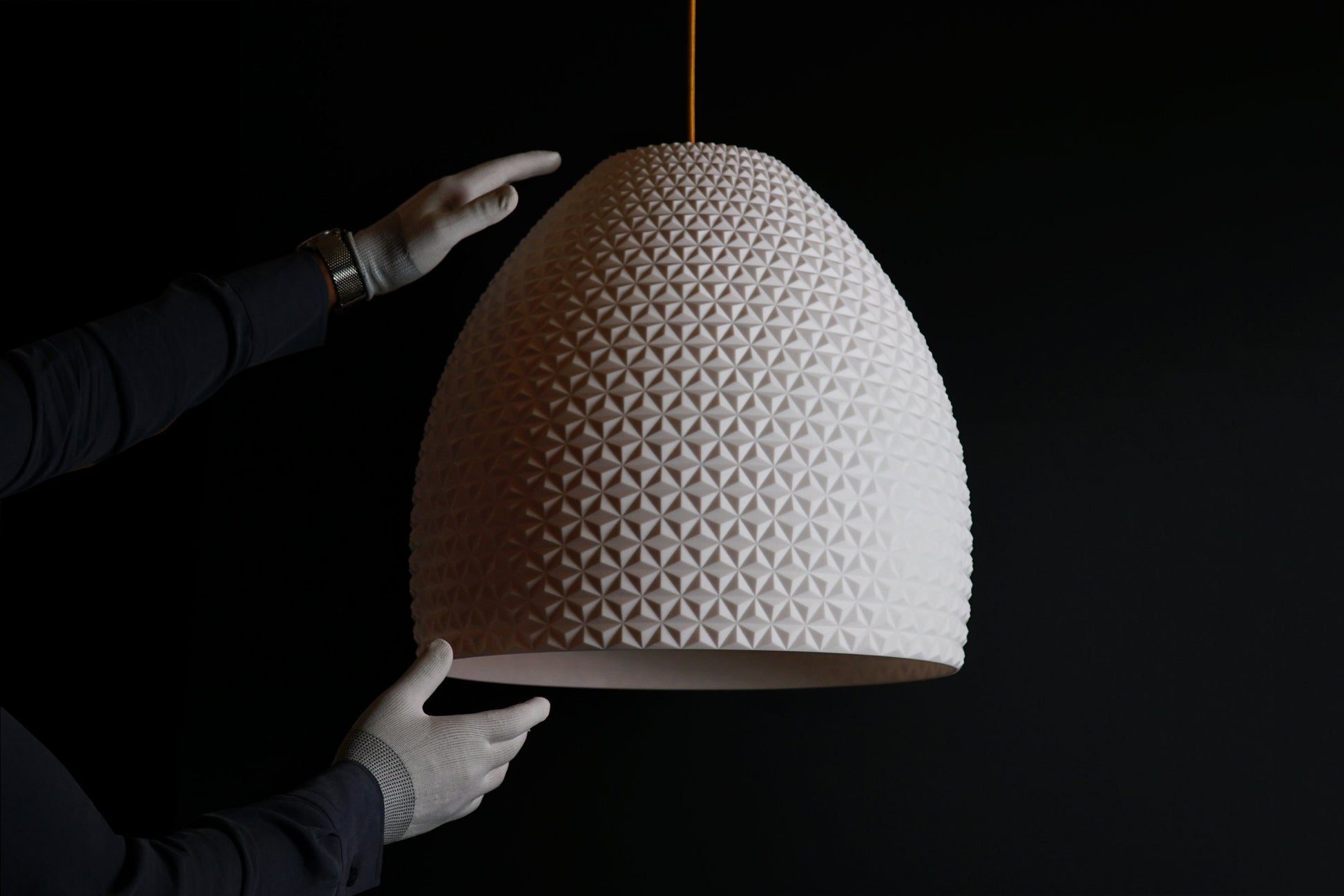 White geometric dome pendant light turned off, showcasing sculptural geometric design