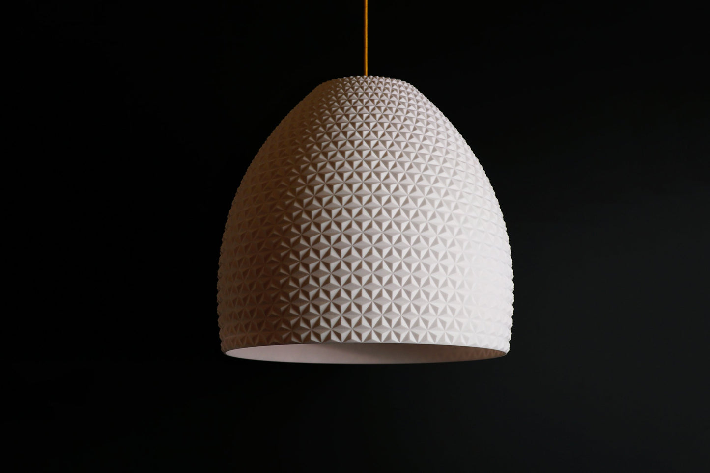 White geometric dome pendant light with faceted dome design, modern sculptural ceiling fixture.