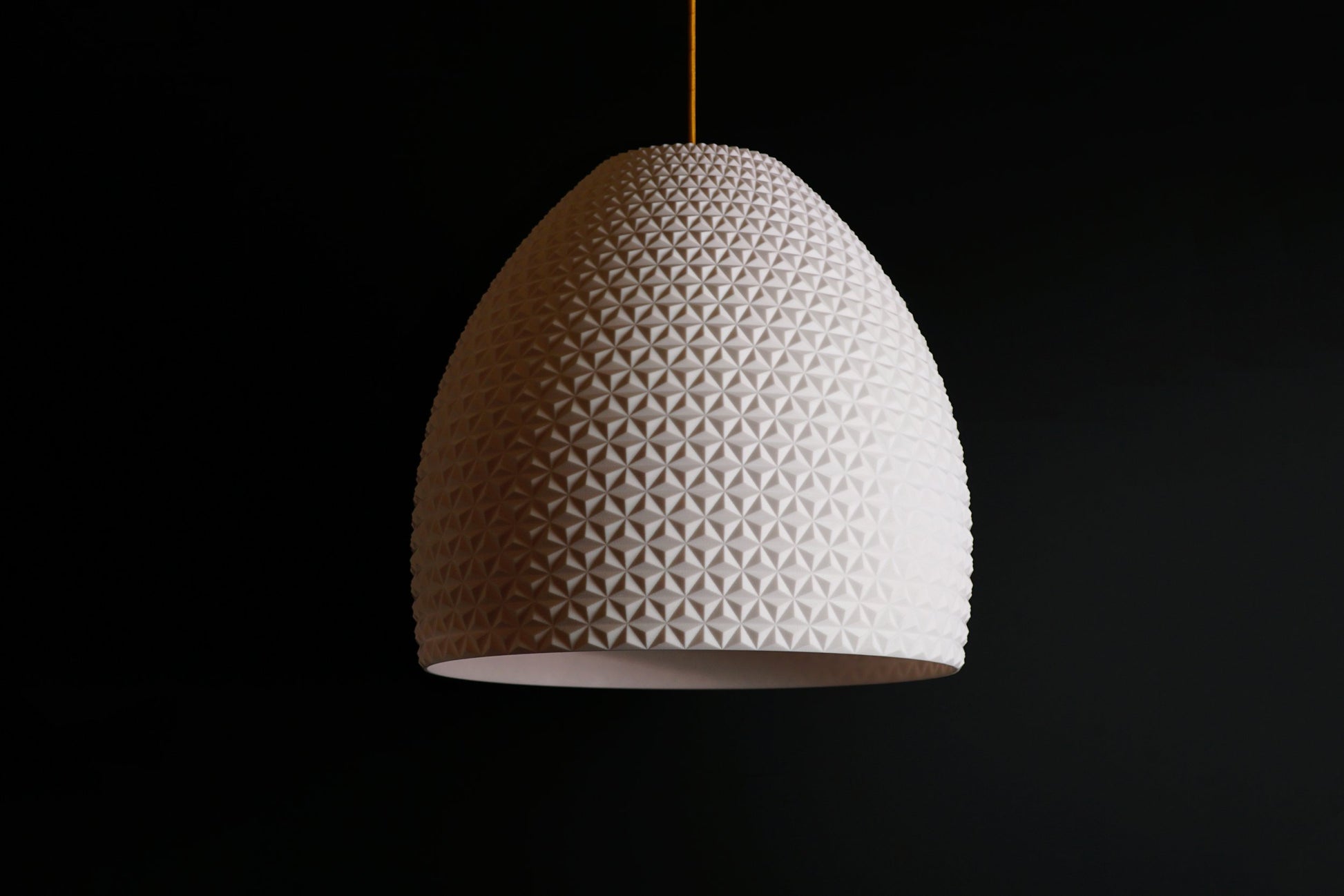White geometric dome pendant light with faceted dome design, modern sculptural ceiling fixture.