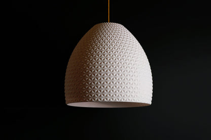 White geometric dome pendant light with faceted dome design, modern sculptural ceiling fixture.