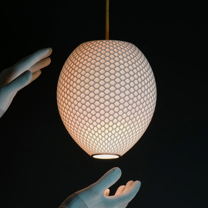 Modern interior featuring White Round Hive Pendant Light as luxury statement fixture
